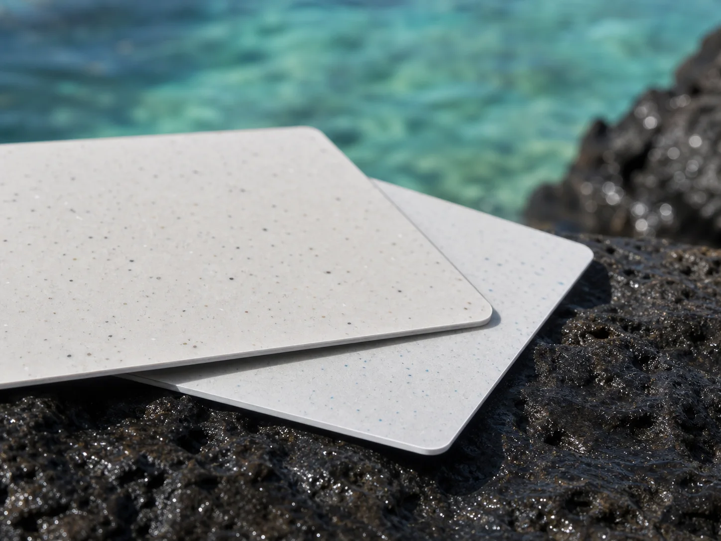 Macro view of thin recycled-PVC card edges and mineral flecks